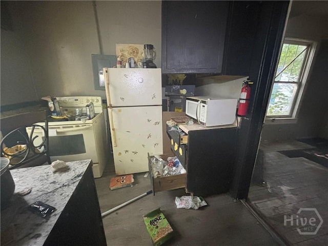 710 W 38th St, Savannah, GA 31415 - kitchen with white appliances and electric panel