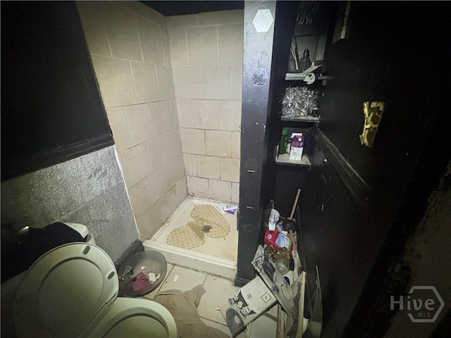 710 W 38th St, Savannah, GA 31415 - full bathroom with a stall shower and concrete block wall