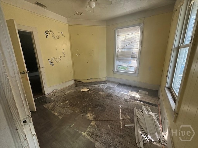 710 W 38th St, Savannah, GA 31415 - empty room featuring healthy amount of natural light and a ceiling fan
