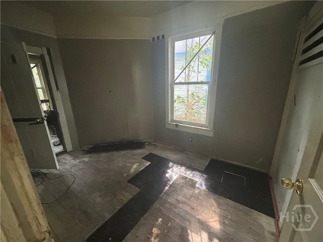 710 W 38th St, Savannah, GA 31415 - unfurnished bedroom featuring hardwood / wood-style floors