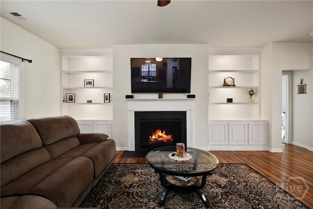 5 Olde Gate Ct, Pooler, GA 31322 - living area with built in features, dark wood-style floors, and a fireplace with flush hearth