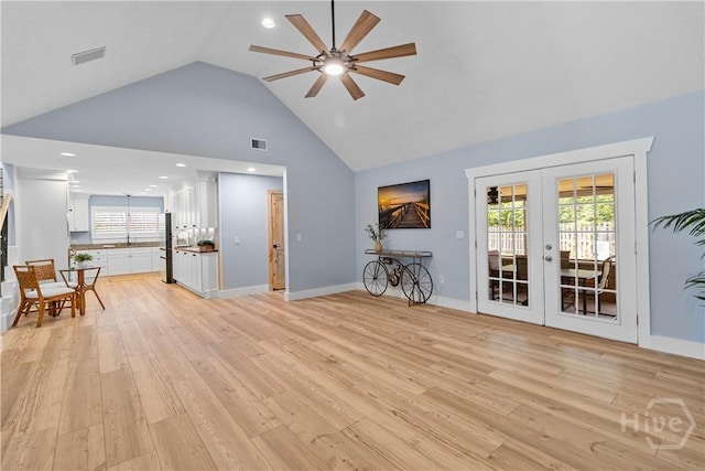 115 Coquena Cir E, Savannah, GA 31410 - living room with a ceiling fan, french doors, light wood-style floors, and high vaulted ceiling