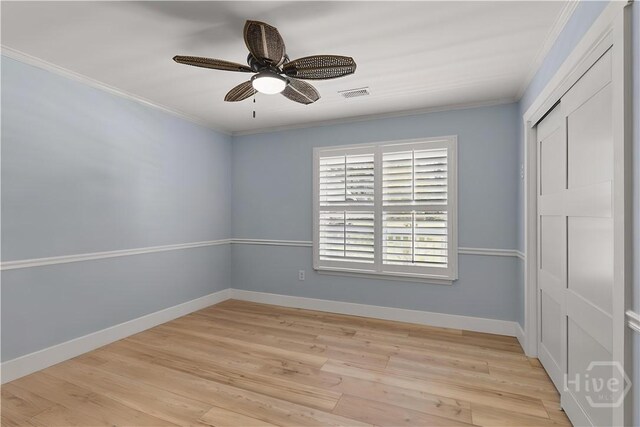 115 Coquena Cir E, Savannah, GA 31410 - unfurnished bedroom featuring crown molding, light wood-style flooring, a closet, and a ceiling fan