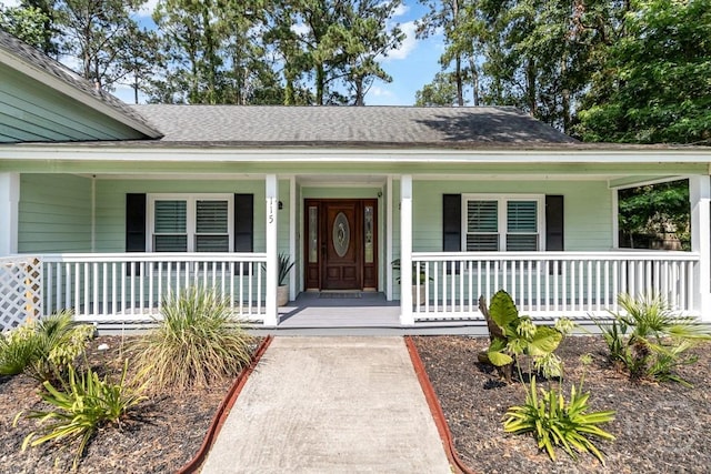 115 Coquena Cir E, Savannah, GA 31410 - property entrance with covered porch and a shingled roof