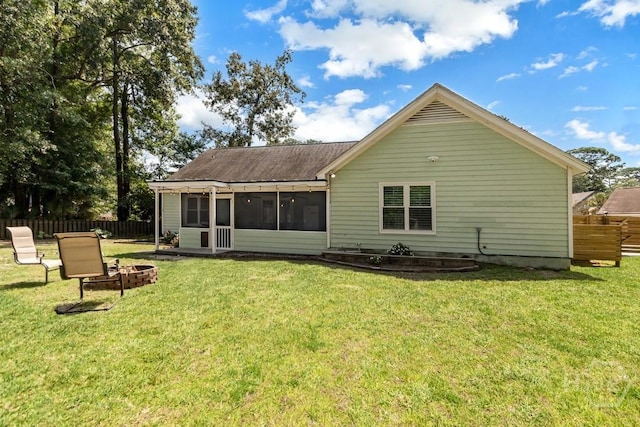115 Coquena Cir E, Savannah, GA 31410 - rear view of property with a sunroom, a fire pit, and roof with shingles