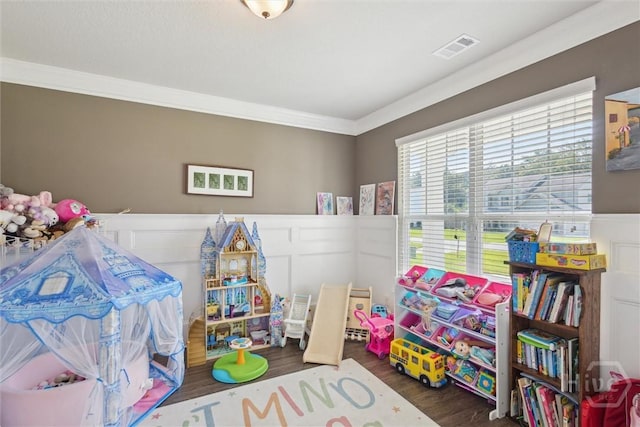 105 Summer Station Dr, Guyton, GA 31312 - recreation room with a wainscoted wall, wood finished floors, crown molding, and a decorative wall
