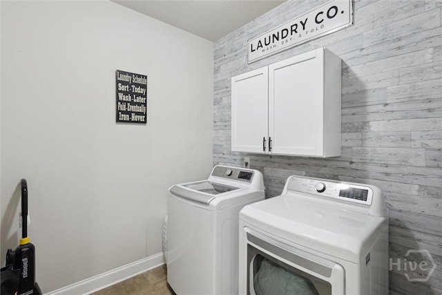 105 Summer Station Dr, Guyton, GA 31312 - laundry room with washing machine and clothes dryer, cabinet space, and wood walls