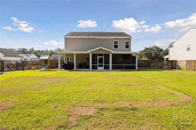 105 Summer Station Dr, Guyton, GA 31312 - rear view of house with a sunroom, a playground, a fenced backyard, and a patio area