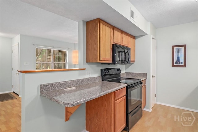 401 N Cromwell Rd Unit Q2, Savannah, GA 31410 - kitchen with black appliances and light wood-type flooring