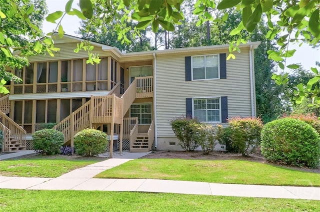 401 N Cromwell Rd Unit Q2, Savannah, GA 31410 - view of front of property featuring a sunroom, stairs, a front lawn, and crawl space