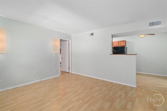 401 N Cromwell Rd Unit Q2, Savannah, GA 31410 - spare room featuring light wood-type flooring and baseboards