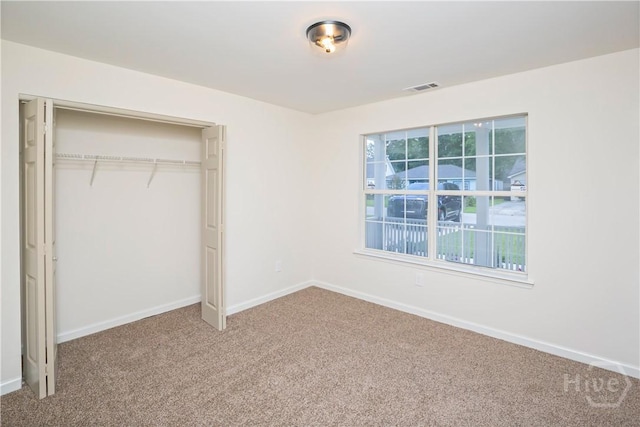 7231 Grant St, Savannah, GA 31406 - unfurnished bedroom featuring carpet and a closet
