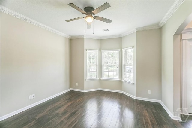 804 Barrington Dr, Hinesville, GA 31313 - spare room with arched walkways, a ceiling fan, dark wood finished floors, and ornamental molding