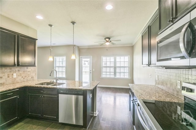 804 Barrington Dr, Hinesville, GA 31313 - kitchen with appliances with stainless steel finishes, ceiling fan, dark wood-type flooring, plenty of natural light, and recessed lighting