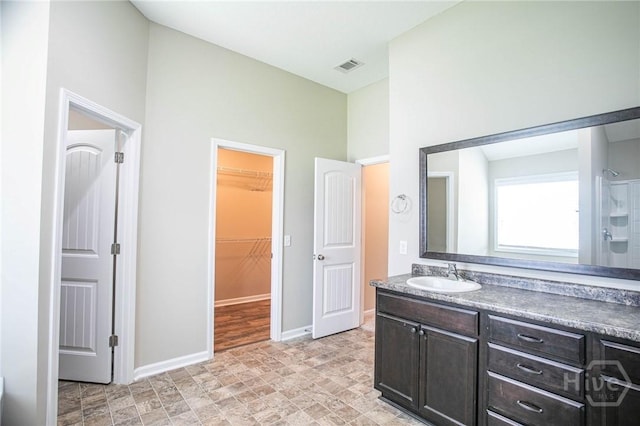 804 Barrington Dr, Hinesville, GA 31313 - bathroom featuring vanity and a spacious closet