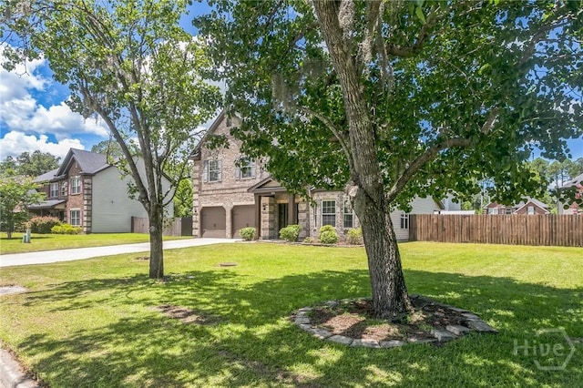 804 Barrington Dr, Hinesville, GA 31313 - view of front of home with a garage, driveway, and stone siding