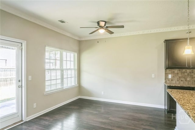 804 Barrington Dr, Hinesville, GA 31313 - unfurnished dining area featuring ceiling fan, dark wood-style floors, and crown molding