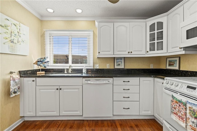 12502 Apache Ave Unit 18, Savannah, GA 31419 - kitchen featuring white appliances, crown molding, white cabinetry, glass insert cabinets, and dark wood finished floors