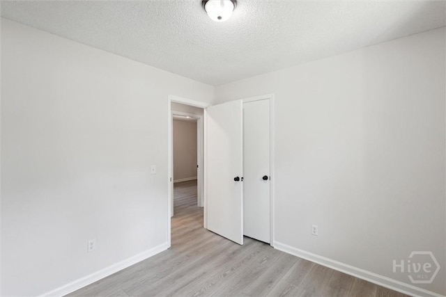 1021 Walnut Ct, Springfield, GA 31329 - spare room with light wood-style floors and a textured ceiling