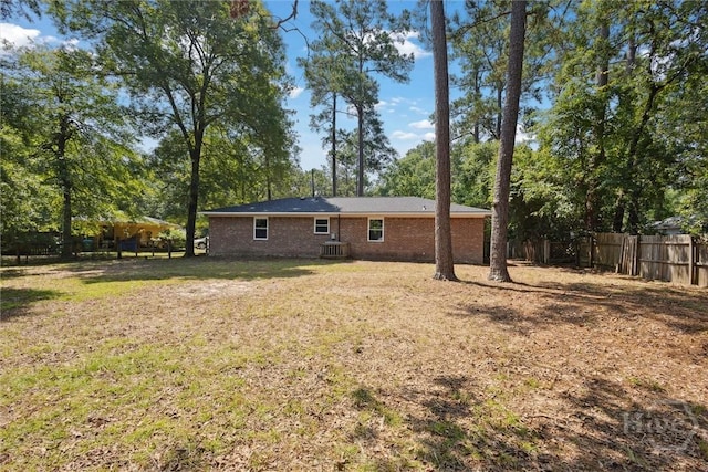 1021 Walnut Ct, Springfield, GA 31329 - rear view of property with a fenced backyard and brick siding