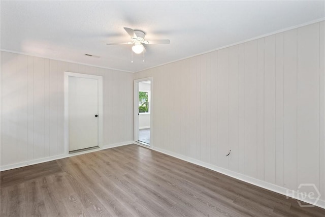 1021 Walnut Ct, Springfield, GA 31329 - empty room featuring wood finished floors, ceiling fan, and crown molding