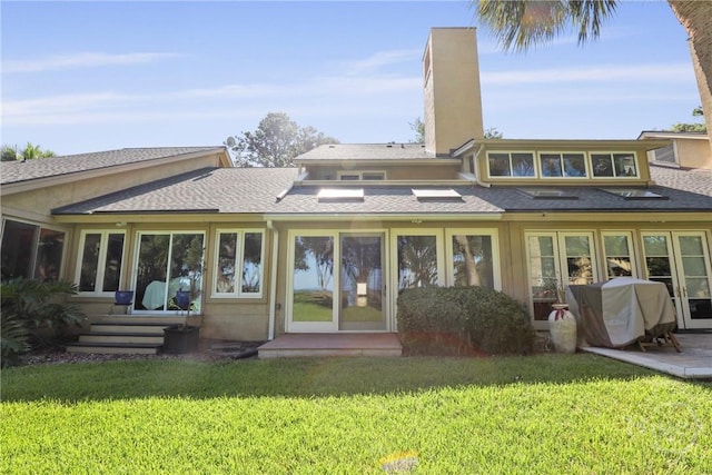 4 Tapestry Ln, Savannah, GA 31411 - back of property with a chimney, a yard, and roof with shingles