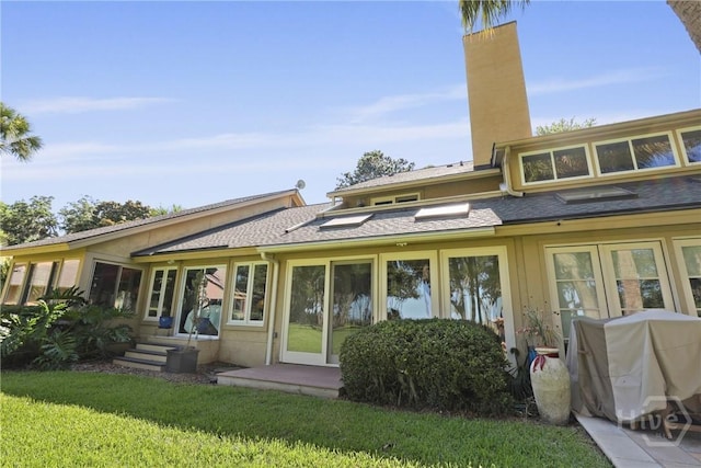 4 Tapestry Ln, Savannah, GA 31411 - back of property with a chimney, a yard, and a shingled roof