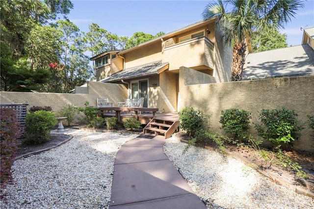4 Tapestry Ln, Savannah, GA 31411 - rear view of property with stucco siding and a wooden deck