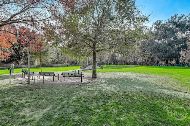 4 Tapestry Ln, Savannah, GA 31411 - surrounding community with a yard and view of wooded area