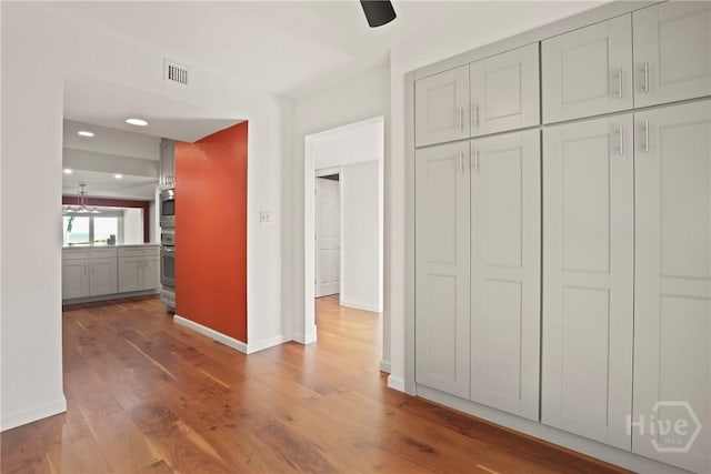 4 Tapestry Ln, Savannah, GA 31411 - unfurnished bedroom featuring wood finished floors, a closet, recessed lighting, and ceiling fan