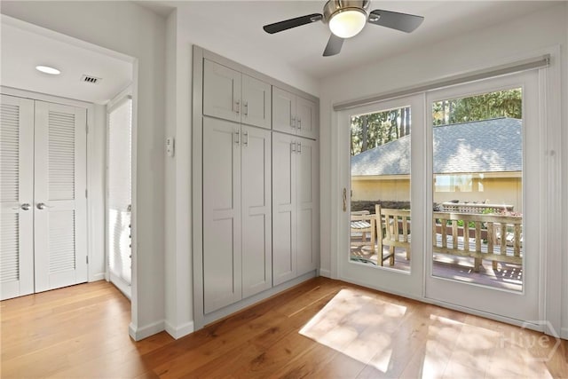 4 Tapestry Ln, Savannah, GA 31411 - unfurnished bedroom with multiple windows, access to outside, light wood-style floors, and a ceiling fan