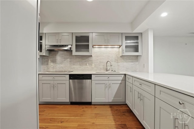 4 Tapestry Ln, Savannah, GA 31411 - kitchen with dishwasher, light wood-style flooring, decorative backsplash, under cabinet range hood, and recessed lighting