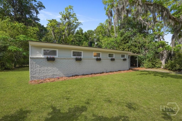 13 Hughes Ave, Savannah, GA 31406 - view of side of property featuring brick siding and a yard