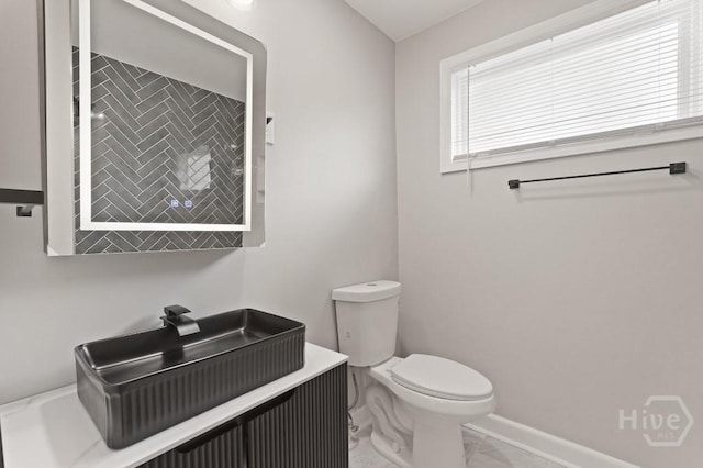 13 Hughes Ave, Savannah, GA 31406 - half bath with marble look tiles and vanity