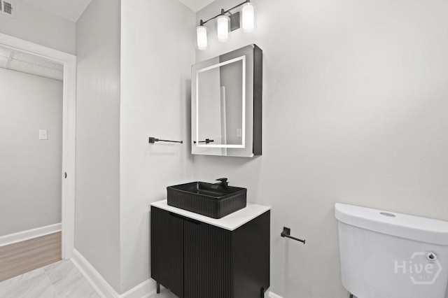 13 Hughes Ave, Savannah, GA 31406 - bathroom featuring toilet and vanity