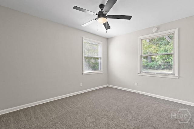 13 Hughes Ave, Savannah, GA 31406 - empty room featuring dark colored carpet, ceiling fan, and a smoke detector