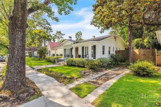 1226 E 50th St, Savannah, GA 31404 - view of front of property with covered porch and a chimney