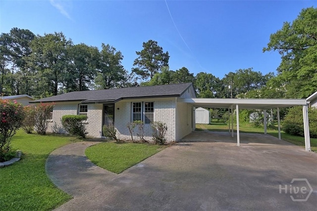 109 E Tietgen St, Pooler, GA 31322 - view of front of home with a front yard, brick siding, driveway, and a carport