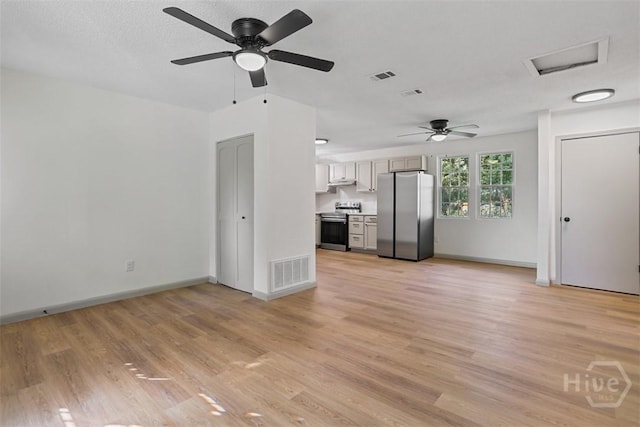 109 E Tietgen St, Pooler, GA 31322 - unfurnished living room featuring a ceiling fan, light wood-type flooring, and attic access