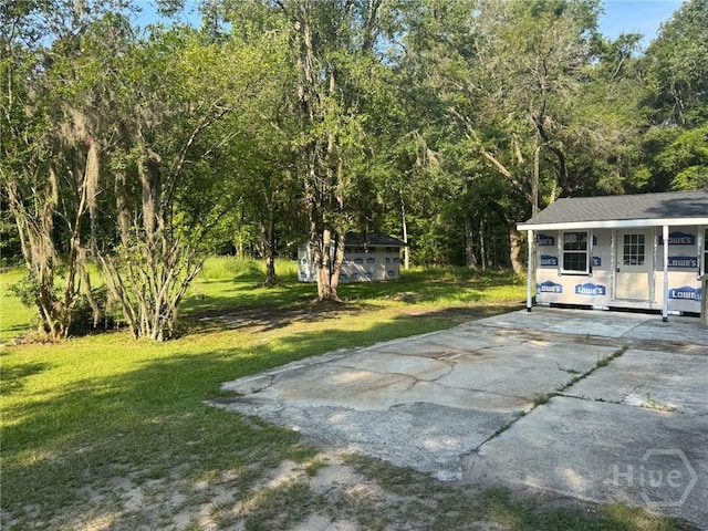 156 Diamond Ln, Midway, GA 31320 - view of patio featuring concrete driveway