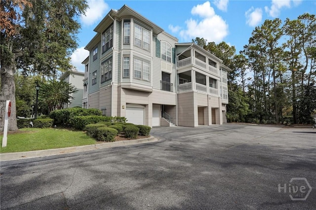 1312 Whitemarsh Way, Savannah, GA 31410 - view of building exterior featuring a garage and driveway