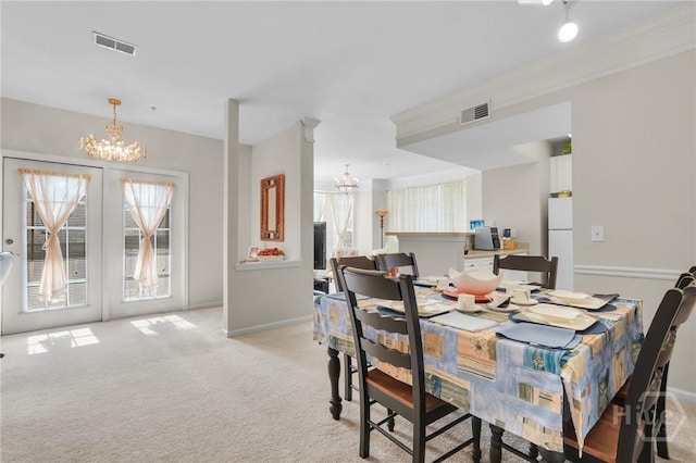 1312 Whitemarsh Way, Savannah, GA 31410 - dining space featuring a chandelier, healthy amount of natural light, and light colored carpet