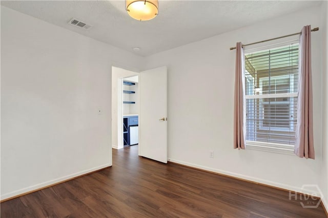106 Dry Dock Ct, Savannah, GA 31410 - unfurnished room with dark wood-style floors and a smoke detector