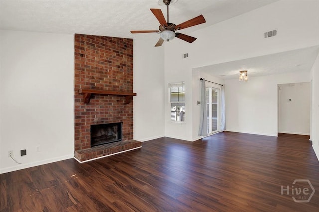 106 Dry Dock Ct, Savannah, GA 31410 - unfurnished living room with a ceiling fan, wood finished floors, a brick fireplace, a chandelier, and vaulted ceiling