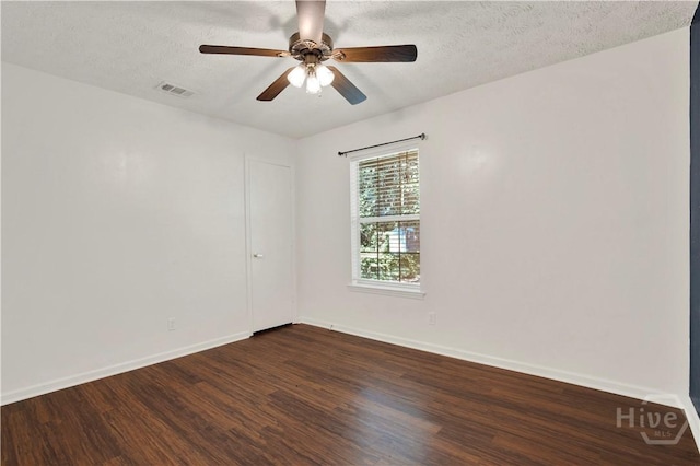 106 Dry Dock Ct, Savannah, GA 31410 - spare room featuring dark wood-style flooring, a ceiling fan, and a textured ceiling