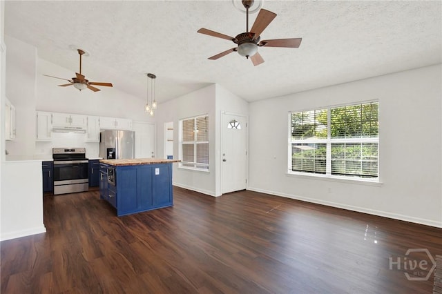 106 Dry Dock Ct, Savannah, GA 31410 - kitchen with blue cabinets, stainless steel appliances, butcher block countertops, a textured ceiling, and lofted ceiling