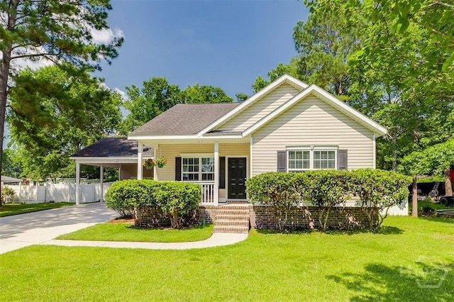 86 Fellwood Dr, Rincon, GA 31326 - view of front facade with driveway, covered porch, an attached carport, and roof with shingles