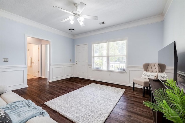86 Fellwood Dr, Rincon, GA 31326 - living room with dark wood finished floors, ornamental molding, a ceiling fan, and a wainscoted wall