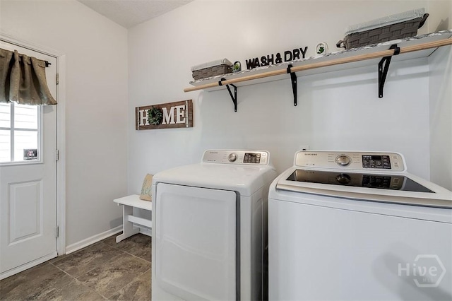 86 Fellwood Dr, Rincon, GA 31326 - laundry area with washer and dryer and dark stone finish flooring