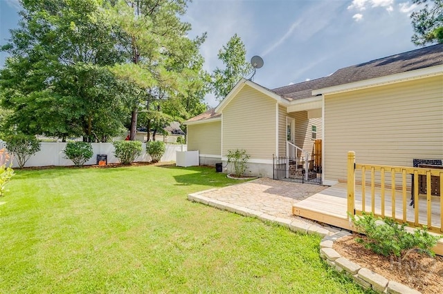 86 Fellwood Dr, Rincon, GA 31326 - fenced backyard with a wooden deck